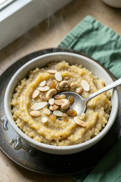 Golden sooji halwa garnished with almonds, cashews and raisins