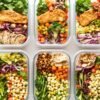 Vibrant vegetarian meals in meal prep containers.