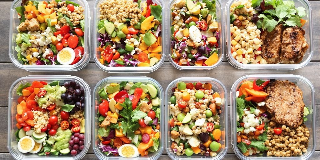 Colorful healthy meals in containers.