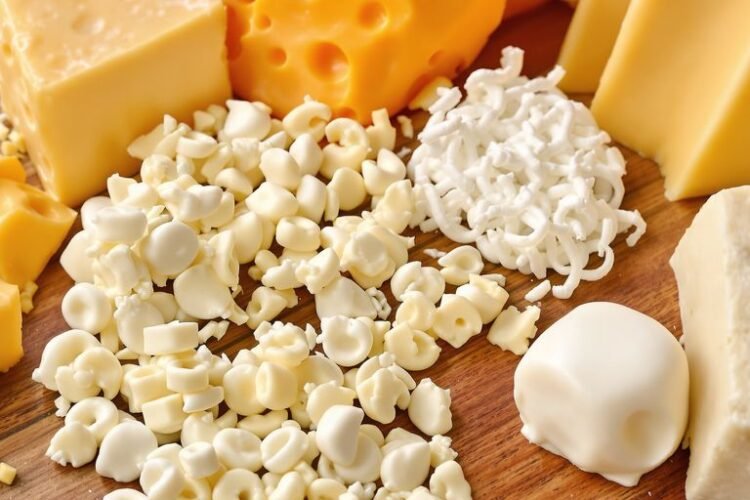 Close-up of various cheeses with visible texture.