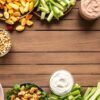Assortment of colorful, healthy snacks on a wooden table.