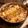 Warm apple casserole with streusel topping.