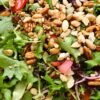 Salad with mixed greens and assorted healthy nuts.