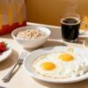Healthy McDonalds breakfast with eggs, oatmeal, fruit, coffee