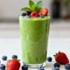 Healthy breakfast smoothie with fresh fruit and mint.
