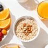 Healthy breakfast spread with fruits and oatmeal.