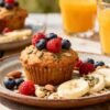 Healthy homemade muffins with fruit and nuts on table