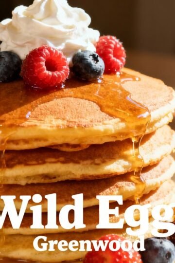 Delicious brunch pancakes with berries at Wild Eggs Greenwood.