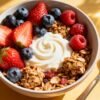 Healthy breakfast bowl with berries and granola.