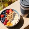 Healthy breakfast bowl and travel mug for on-the-go.