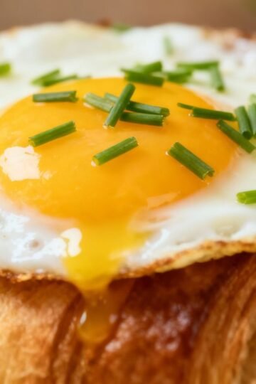 Egg and croissant breakfast combination.