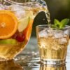 Chardonnay sangria pitcher with fruit and ice.