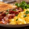 Delicious breakfast plate with eggs and bacon.