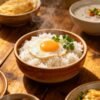 Delicious and easy breakfast rice bowls with egg and garnishes.