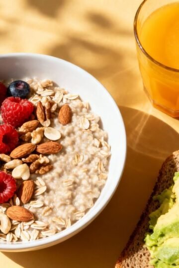 Healthy pregnancy breakfast with oatmeal, berries, and juice.