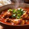 Authentic Mangalorean chicken curry in a bowl with rice.