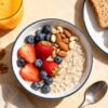 Healthy breakfast spread with oatmeal, berries, and avocado toast.