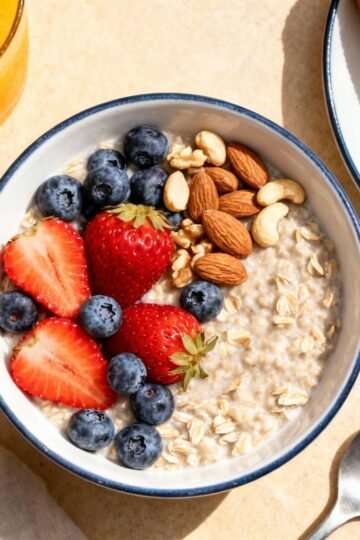 Healthy breakfast spread with oatmeal, berries, and avocado toast.