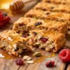 Homemade healthy breakfast bars with oats, nuts, and fruit.