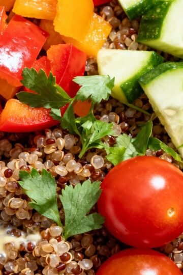 Kaniwa grain bowl with fresh vegetables and herbs.