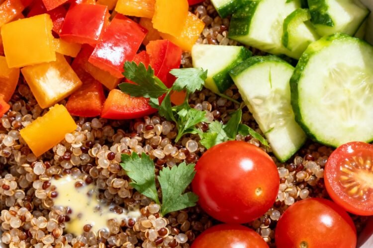 Kaniwa grain bowl with fresh vegetables and herbs.