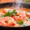 Goan shrimp curry in a bowl with cilantro