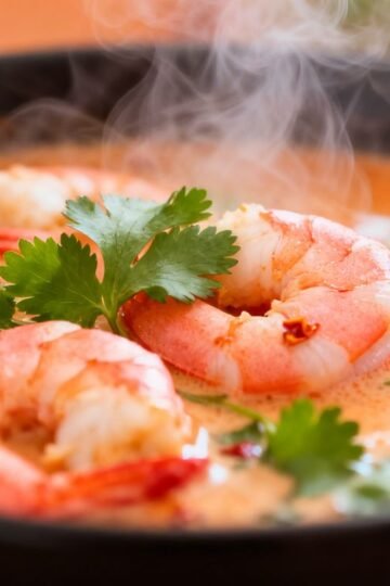 Goan shrimp curry in a bowl with cilantro