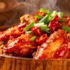 Spicy Chinese Chilli Chicken with green onions and red chilies.