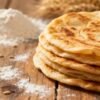 Stack of fluffy, golden-brown rotis