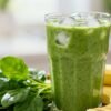 Healthy green breakfast smoothie with banana and spinach.