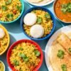 Healthy Indian breakfast dishes like poha, idli, and dosa.