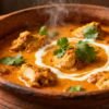 Slow cooked Indian chicken curry in a clay pot.