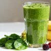 Healthy green smoothie with fresh fruits and spinach.