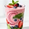 Healthy fruit smoothie with berries and spinach