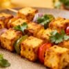Paneer tikka appetizer on a platter